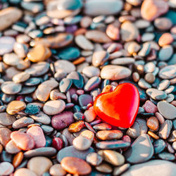 High angle view of multi colored stones on pebbles