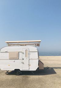 Lifeguard hut on beach against clear sky