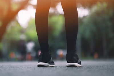 Low section of woman standing outdoors