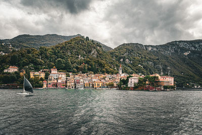 View of varenna from a boat with mountains in the background