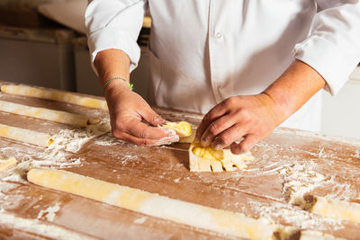 Midsection of chef preparing food