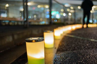 Close-up of beer glass on table at night