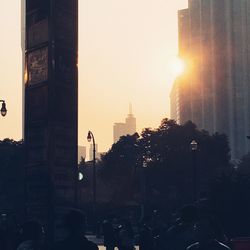 Silhouette of city at sunset