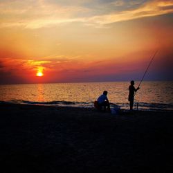 Silhouette of people on beach