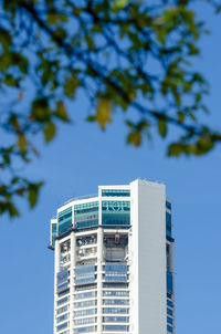 Low angle view of buildings against clear blue sky