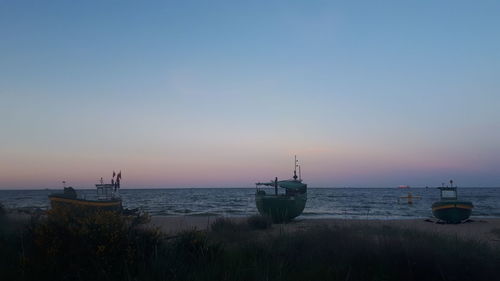 Scenic view of sea against clear sky during sunset