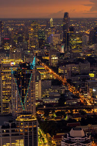 High angle view of illuminated buildings in city at night