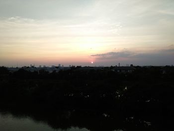 Scenic view of silhouette landscape against sky at sunset