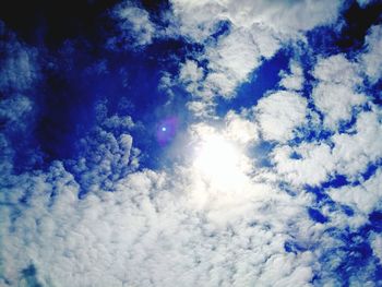 Low angle view of blue sky and clouds