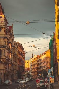 City street and buildings against sky