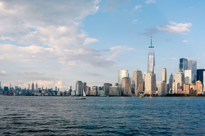 View of manhattan island from jersey city with freedom tower and empire state building in view
