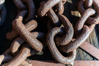 Close-up of rusty chains outdoors