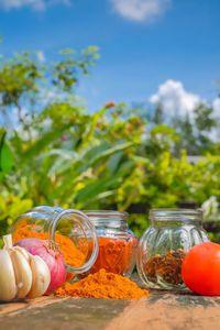 Close-up of fruits in glass jar on table