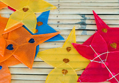 High angle view of multi colored umbrellas on paper