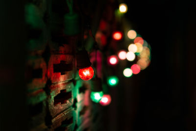 Close-up of illuminated christmas lights at night