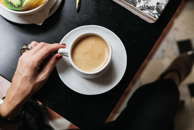 High angle view of coffee cup on table