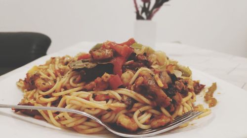 Close-up of noodles served in plate on table