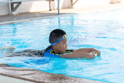 Woman swimming in pool