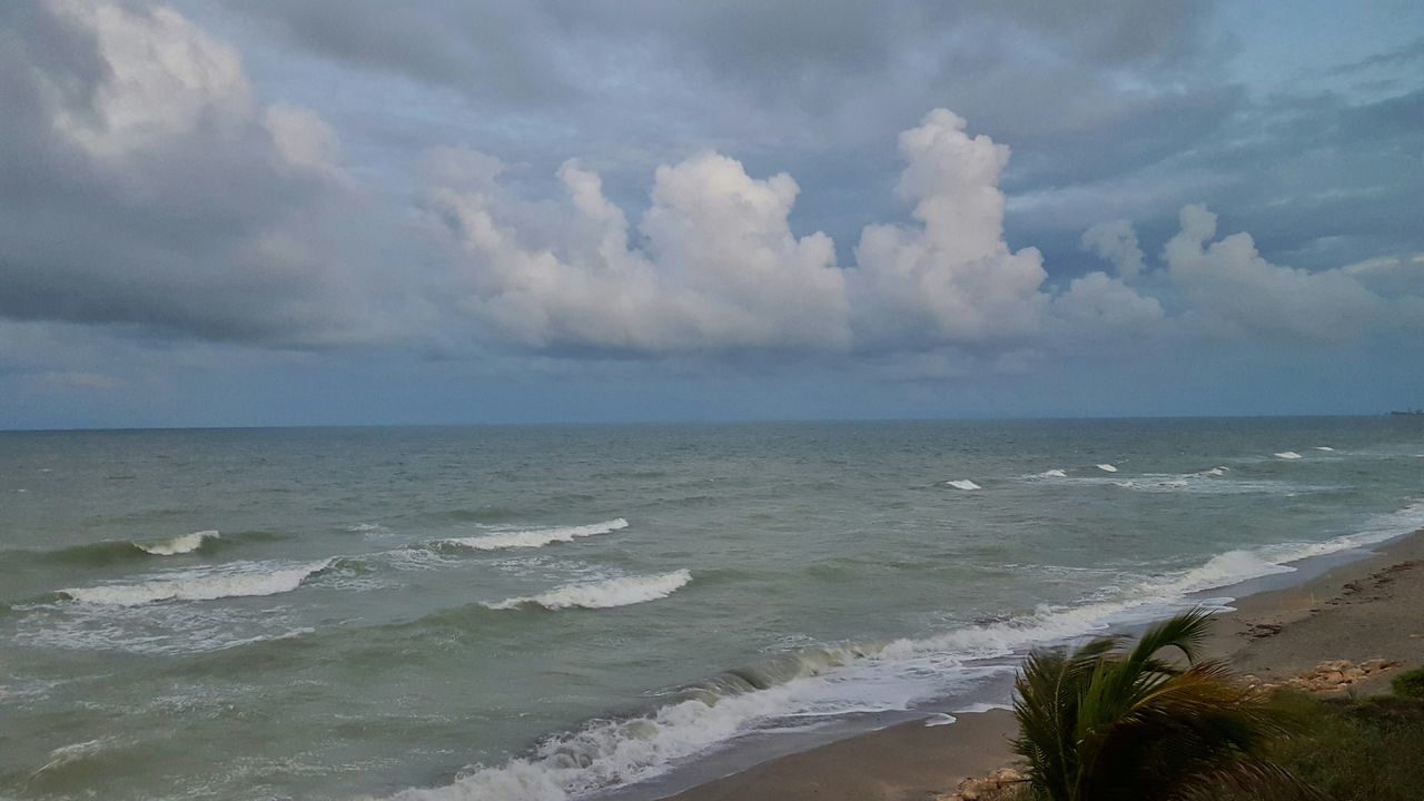 sea, horizon over water, beach, water, sky, shore, scenics, tranquil scene, tranquility, beauty in nature, sand, nature, cloud - sky, coastline, wave, idyllic, cloud, cloudy, surf, outdoors