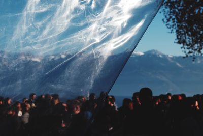 People standing in water against sky