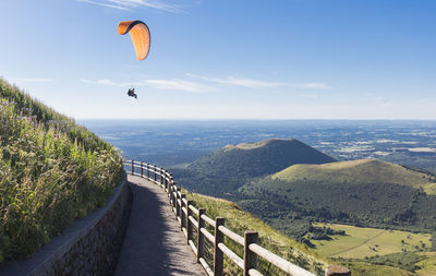 Paragliding at the top of the puy de dome in front of the puys chain in auvergne