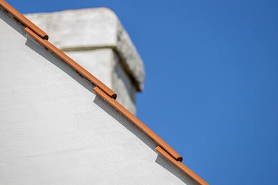 Low angle view of building against blue sky