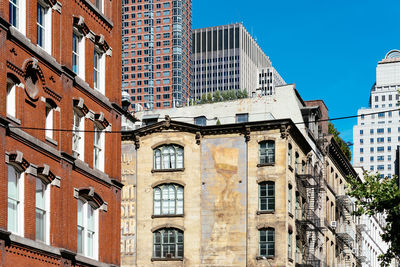 Low angle view of residential building against blue sky