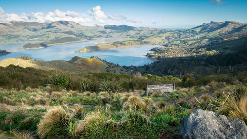 Scenic view of landscape and mountains against sky