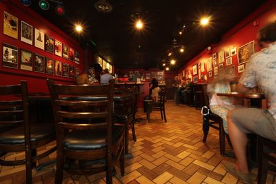 Chairs and tables in cafe at night