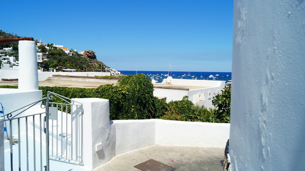 VIEW OF SWIMMING POOL AGAINST CLEAR BLUE SKY