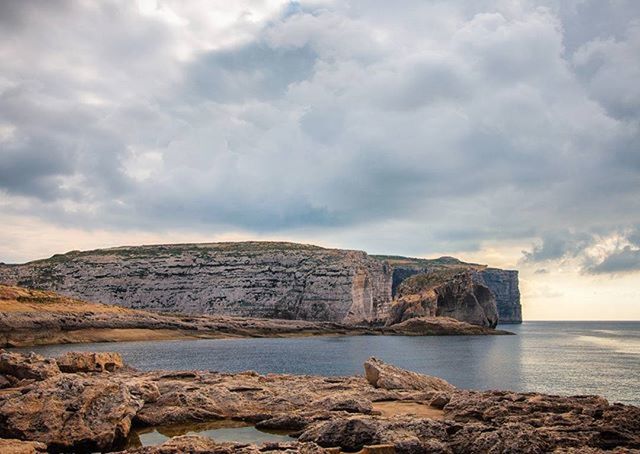 sky, water, scenics, sea, tranquil scene, tranquility, cloud - sky, rock - object, beauty in nature, mountain, cloudy, nature, rock formation, cloud, idyllic, rock, shore, mountain range, outdoors, non-urban scene