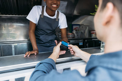 Man paying bill at food truck