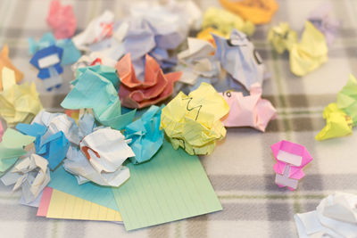 Close-up of multi colored paper on table