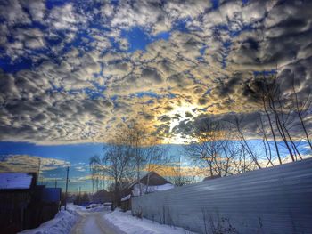 Scenic view of landscape against cloudy sky