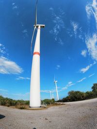 Low angle view of lighthouse against blue sky