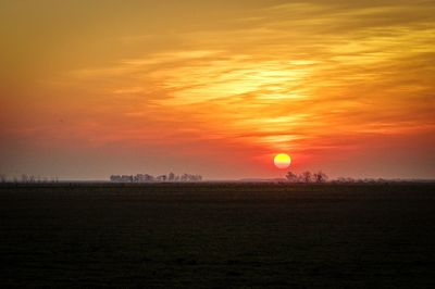 Scenic view of landscape at sunset