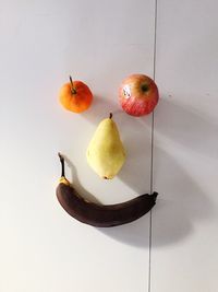 Close-up of fruits against white background