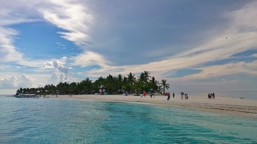 Scenic view of sea against cloudy sky