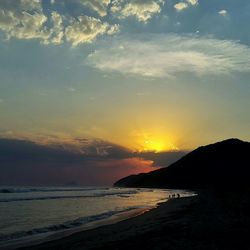 Scenic view of sea against dramatic sky