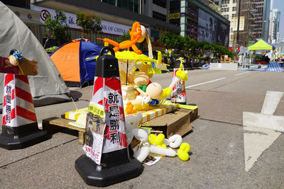 Traffic cones by art decoration on city street