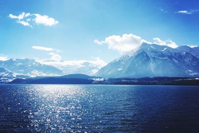 Idyllic view of snowcapped mountains against sky