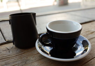 Close-up of coffee cup on table