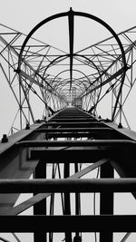 Low angle view of bridge against sky in city