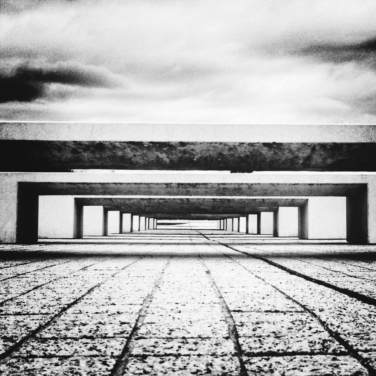 sky, built structure, architecture, cloud - sky, building exterior, cloudy, cloud, water, cobblestone, the way forward, railing, day, walkway, outdoors, empty, no people, footpath, overcast, sea, nature