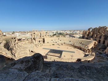 Panoramic view of old ruins against clear blue sky