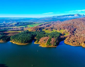 High angle view of lake against blue sky