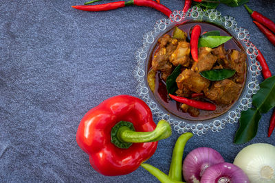 High angle view of red chili peppers on table