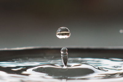 Close-up of splashing droplet of water in container