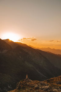 Scenic view of mountains against sky during sunset