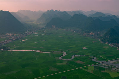 Aerial view of landscape and mountains against sky